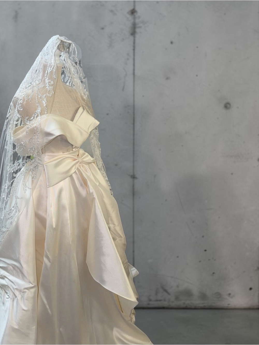 Elegant Ivory Satin Wedding Gown with Bow